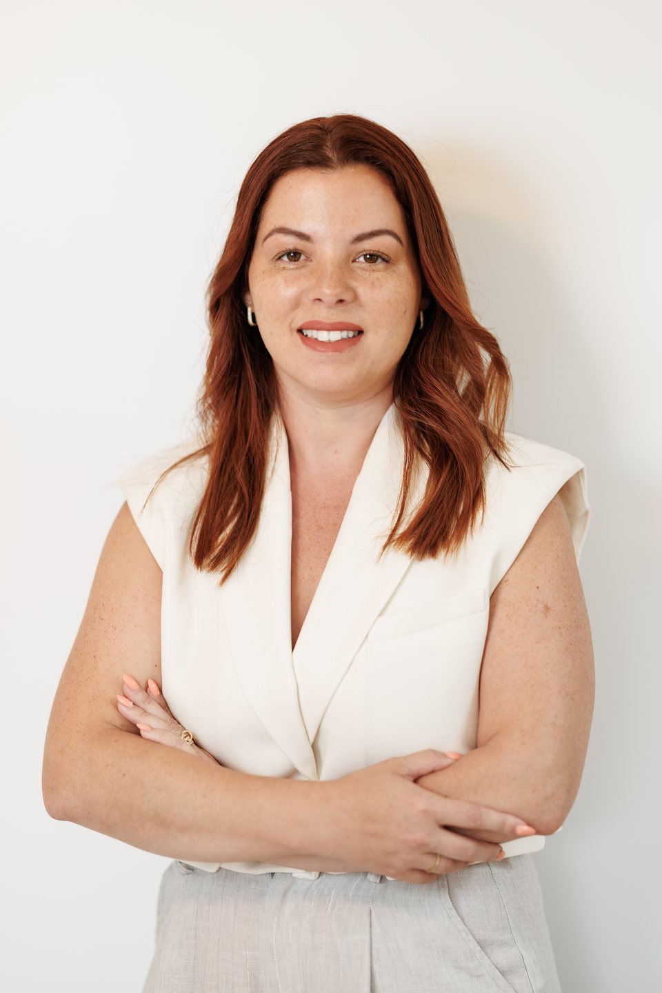 Red-haired business owner, confident on-site studio portrait